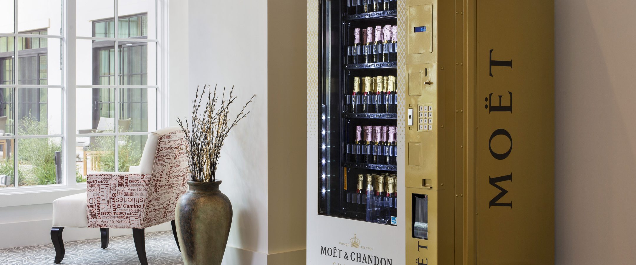 A vending machine for mini Moet champagne bottles.